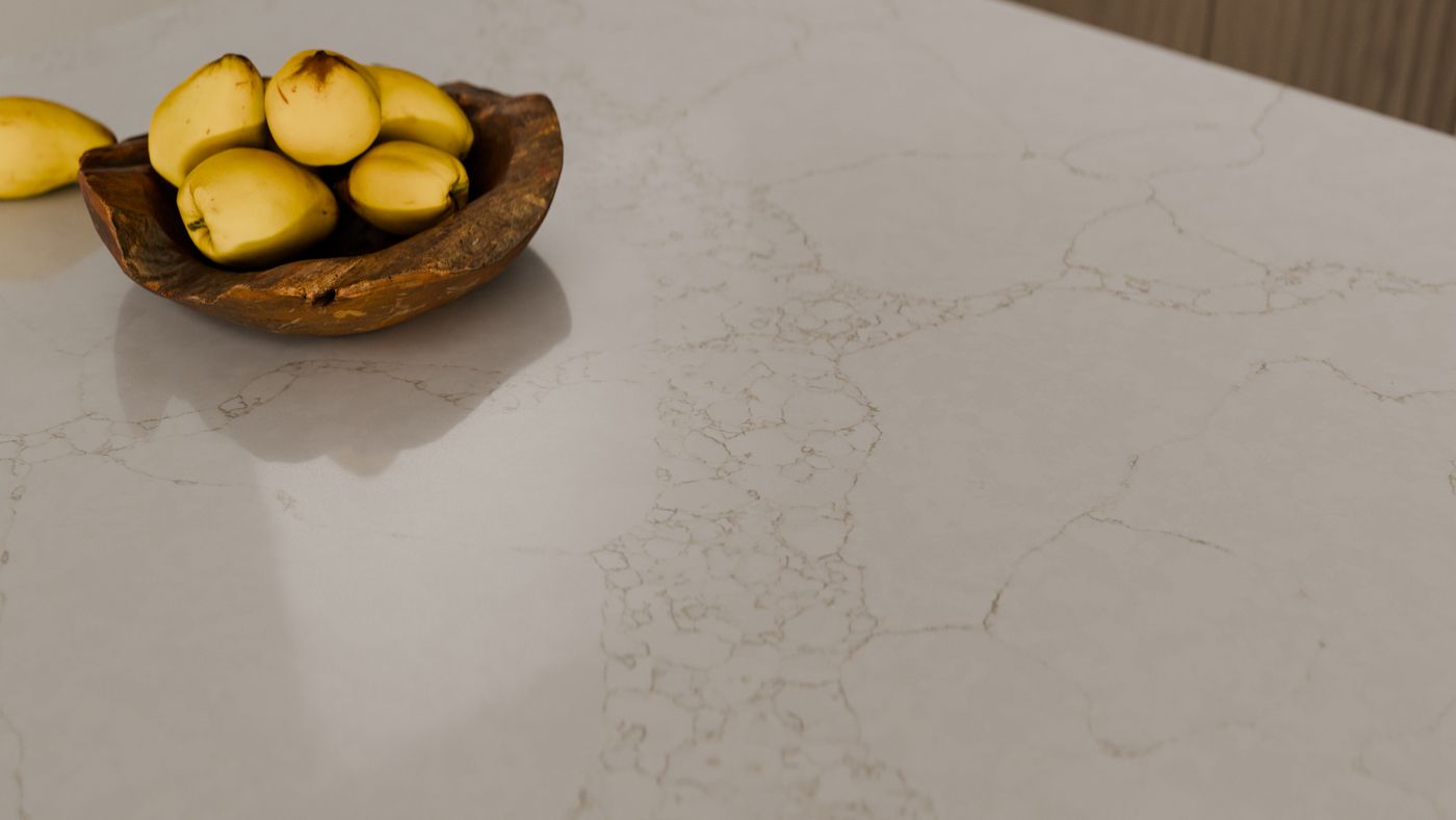 Warm taupe pebbled vein-network on ivory zero-silica quartz, interior scene 2